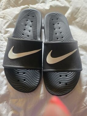 Nike Black Slides with White Swoosh Logo